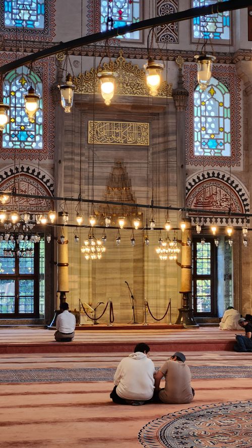 Free Peaceful interior of a historic mosque in Istanbul with stained glass and intricate designs. Stock Photo