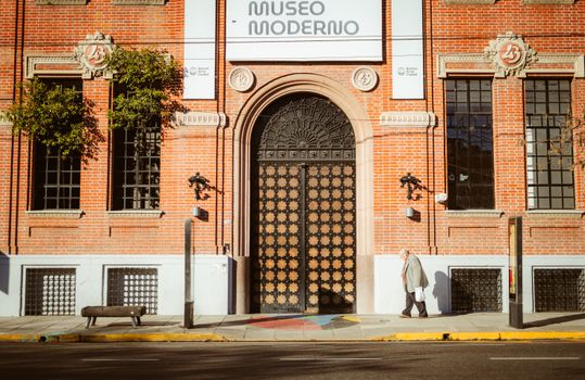 Street view of Museo Moderno in Buenos Aires with a lone pedestrian.