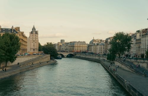 Free Charming view of the Seine River and Parisian architecture during twilight. Stock Photo