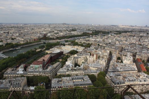 Breathtaking aerial view of Paris cityscape, with the Seine River from the Eiffel Tower.