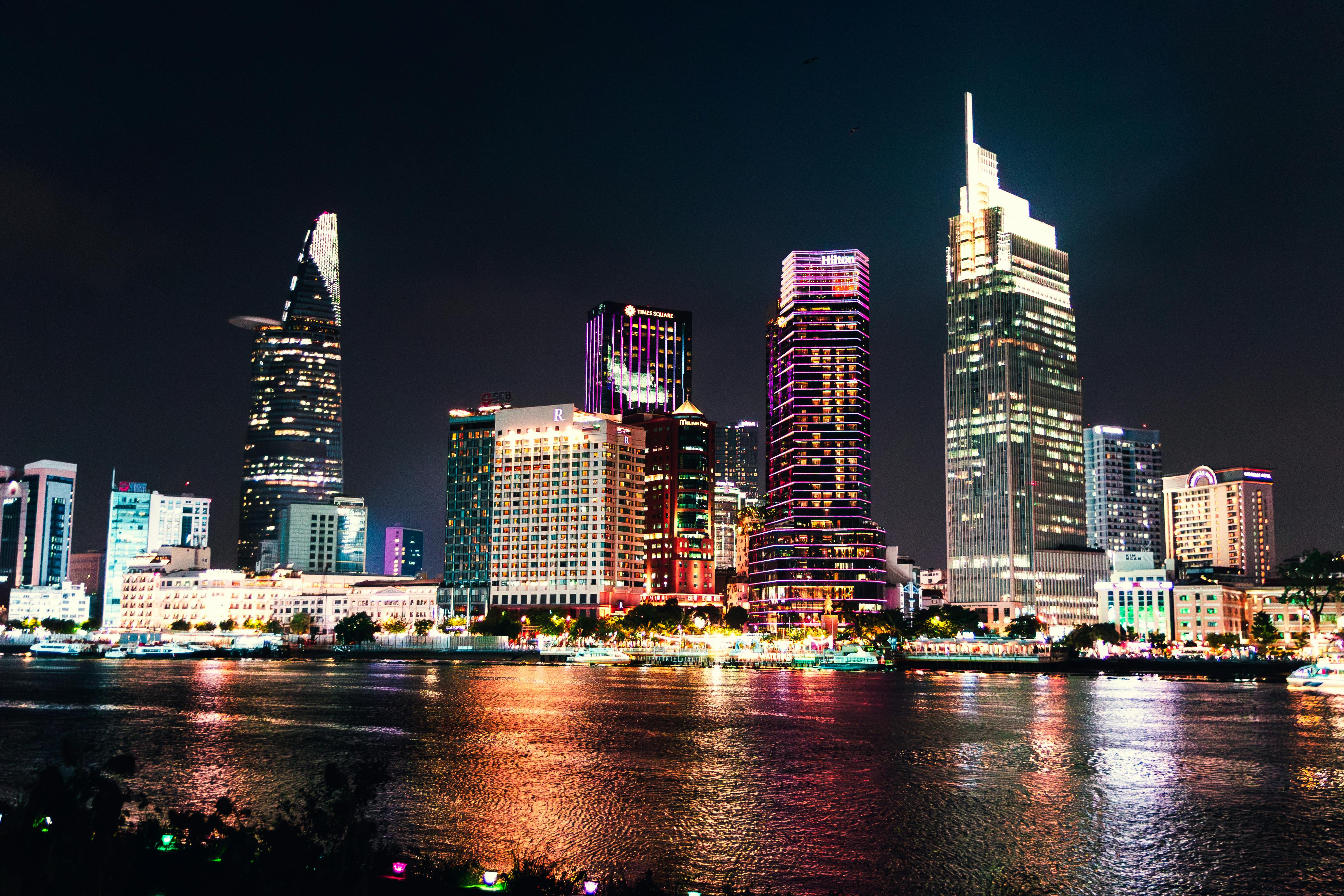 Stunning night view of Ho Chi Minh City's illuminated skyline reflecting on Saigon River. - Ho Chi Minh (Saigon)