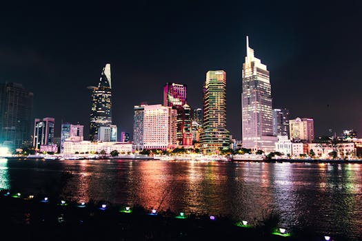 Vibrant and colorful night view of Ho Chi Minh City's iconic skyline reflecting on the river.