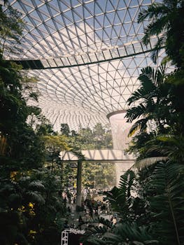 Jewel Changi Airport with its stunning indoor waterfall and lush greenery in Singapore.