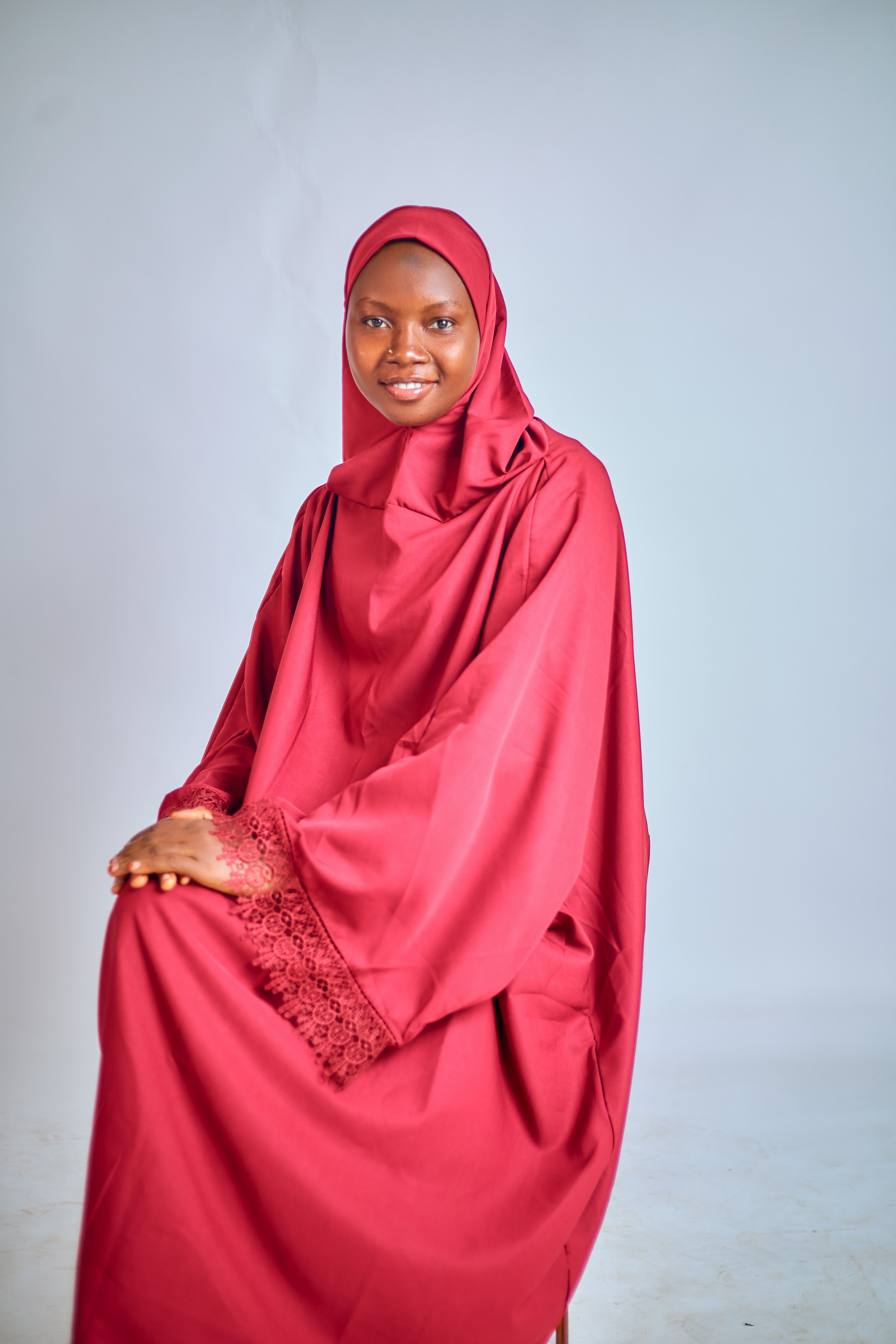 Elegant Woman in Red Hijab Sitting Portrait · Free Stock Photo