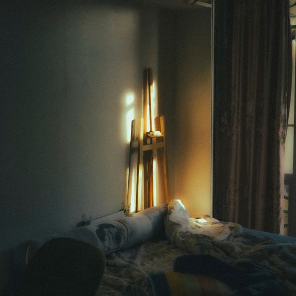 Morning sunlight falling across a quiet bedroom — photo by 天 明 on Pexels
