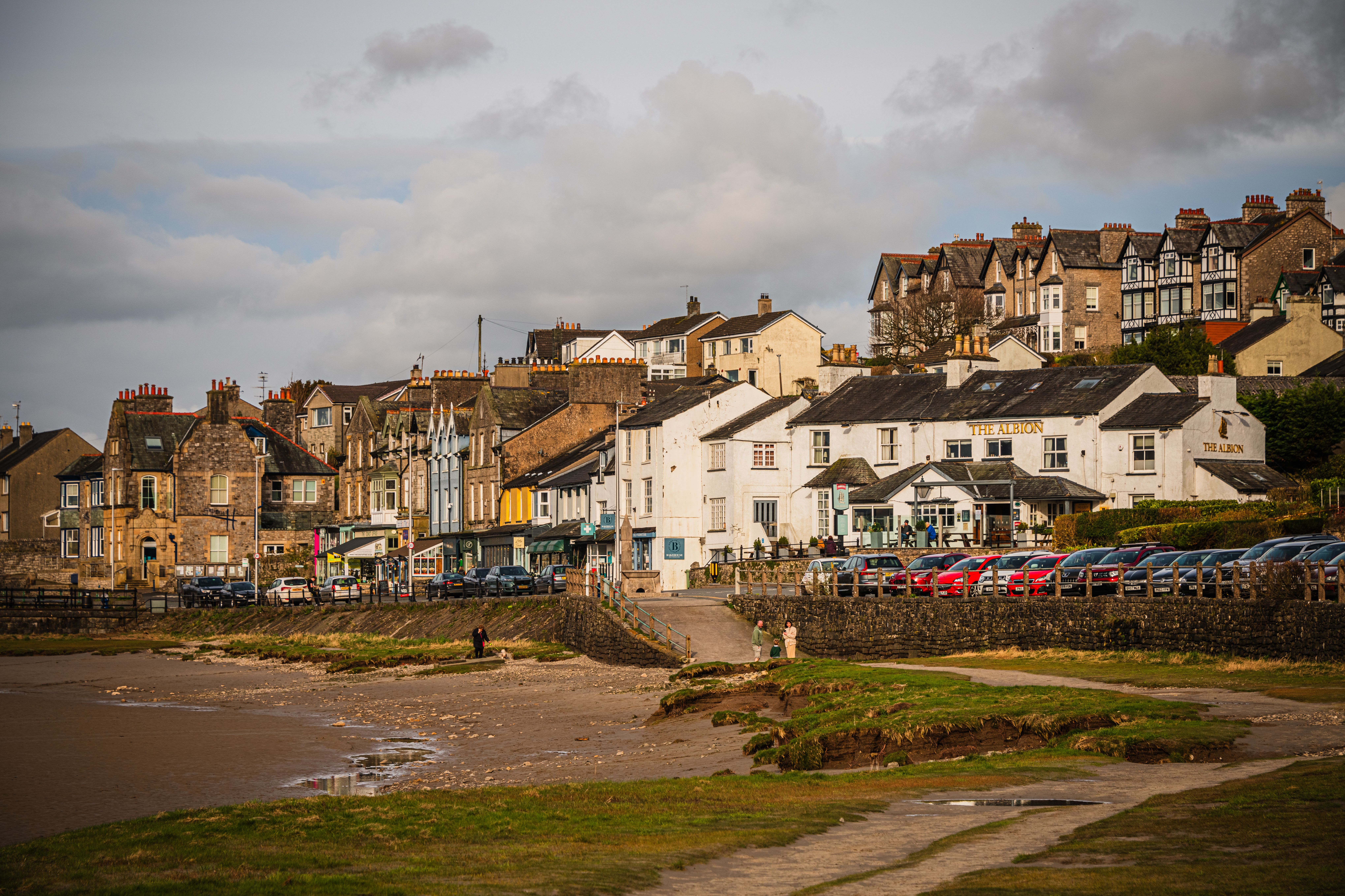 Picturesque view of Arnside village with historic buildings by the seaside, Cumbria, UK.