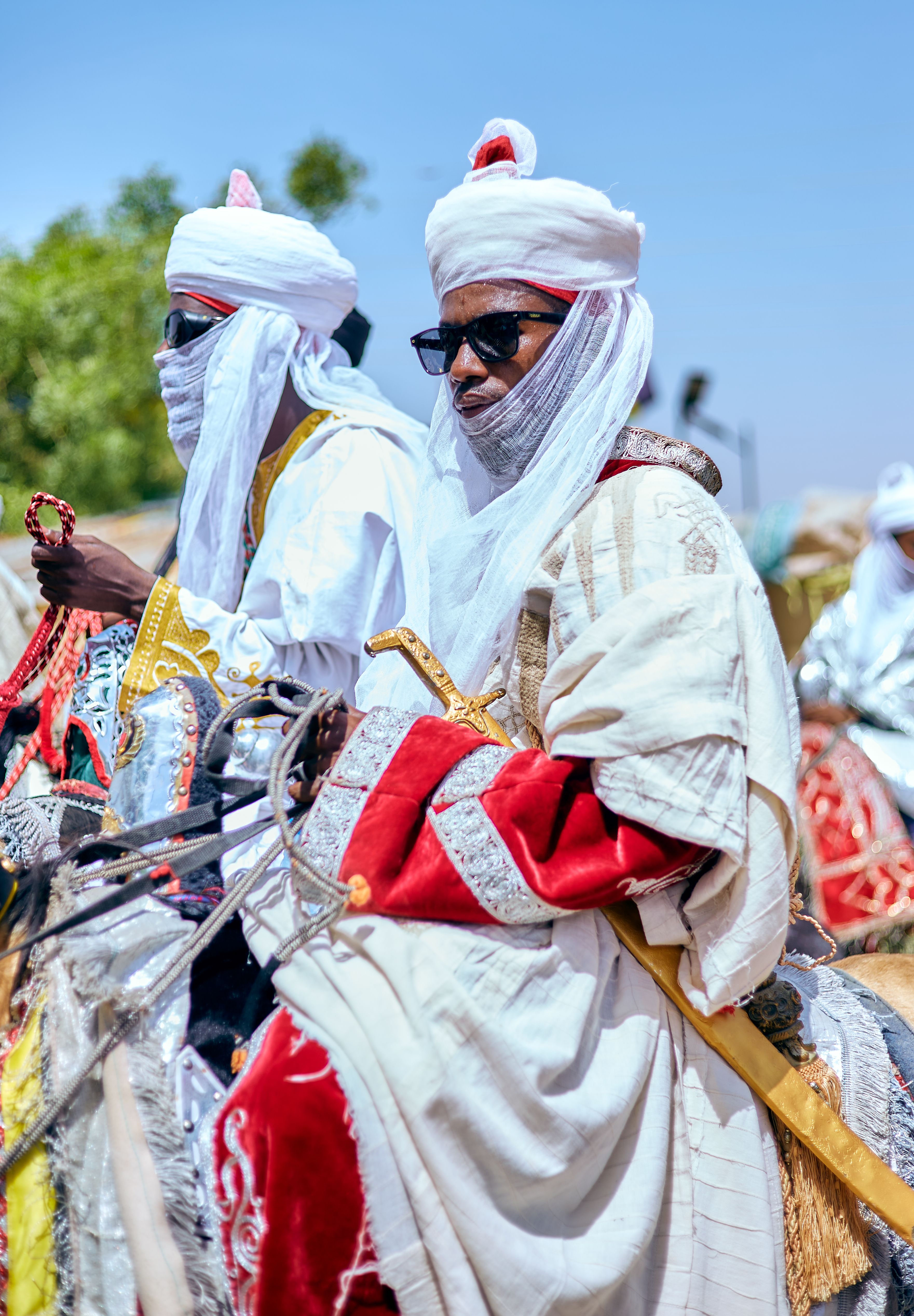 Traditional Horseback Riders in Vibrant Attire · Free Stock Photo