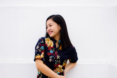 Woman Wearing Blue and Brown Floral Top