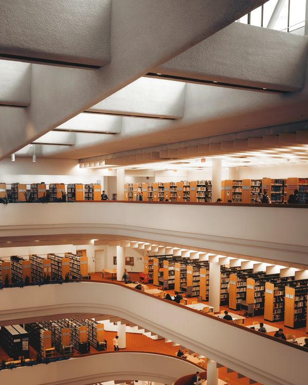 Interior of elegant spacious multistory library · Free Stock Photo