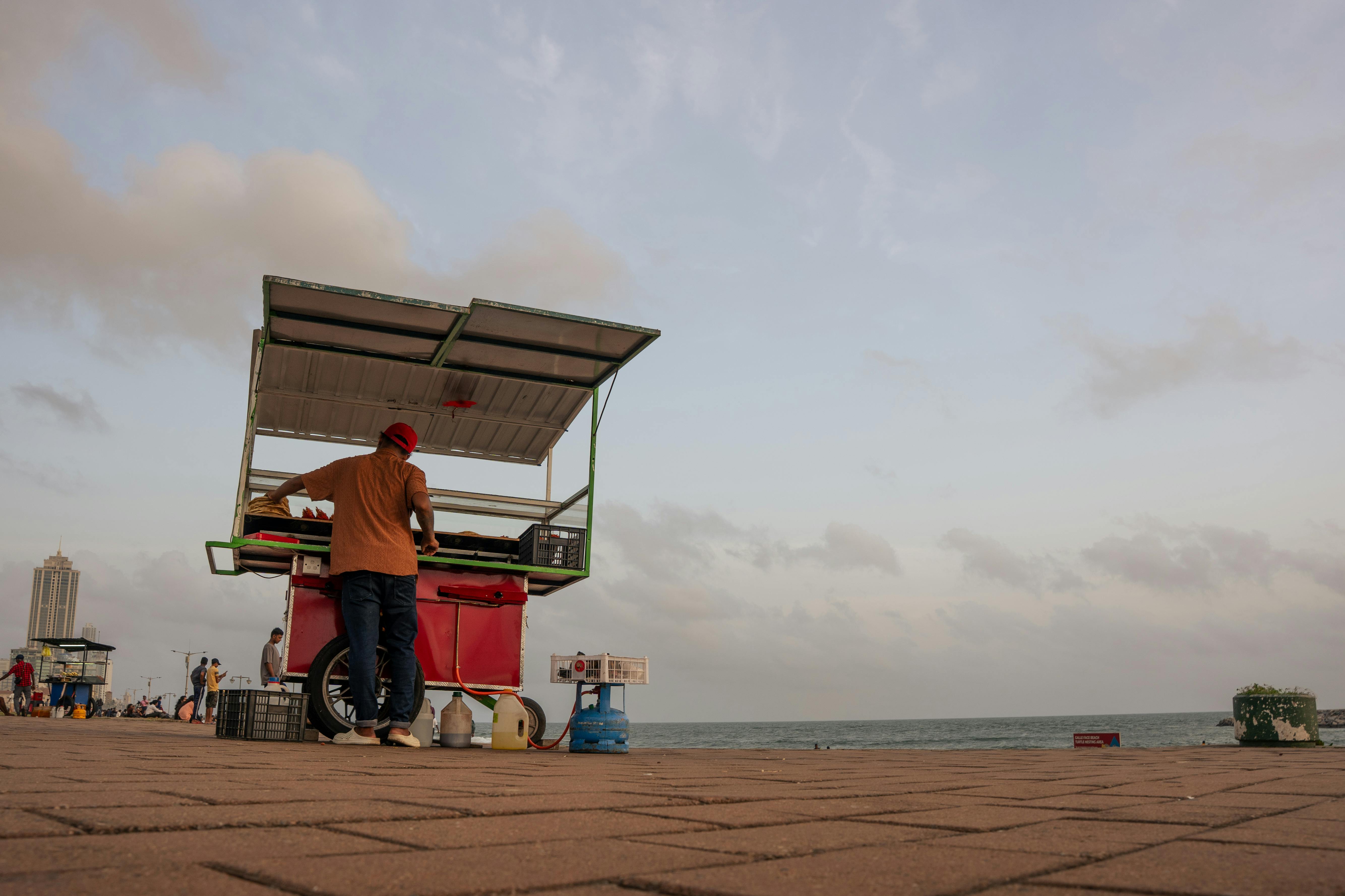Street food vendor cart along the Colombo seafront at Galle Face Green, Sri Lanka.
