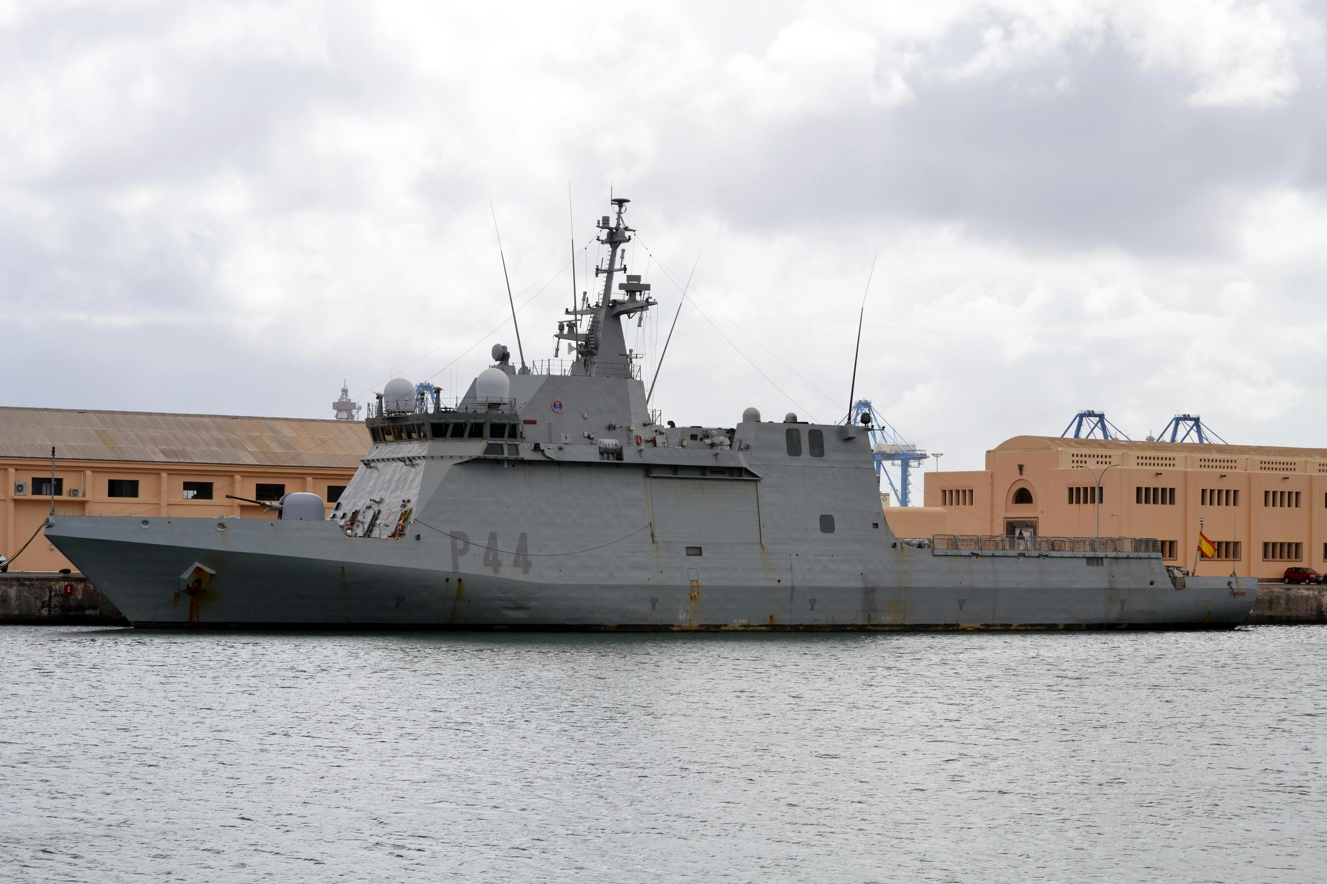 Spanish naval ship P44 docked at Las Palmas de Gran Canaria port under cloudy skies.
