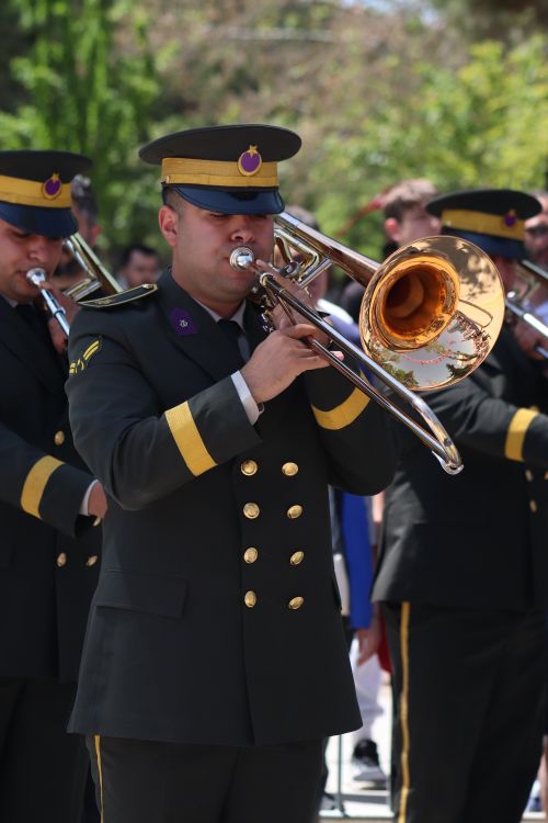 Free Turkish military band members play brass instruments outdoors in Malatya, showcasing ceremonial uniforms and musical performance. Stock Photo