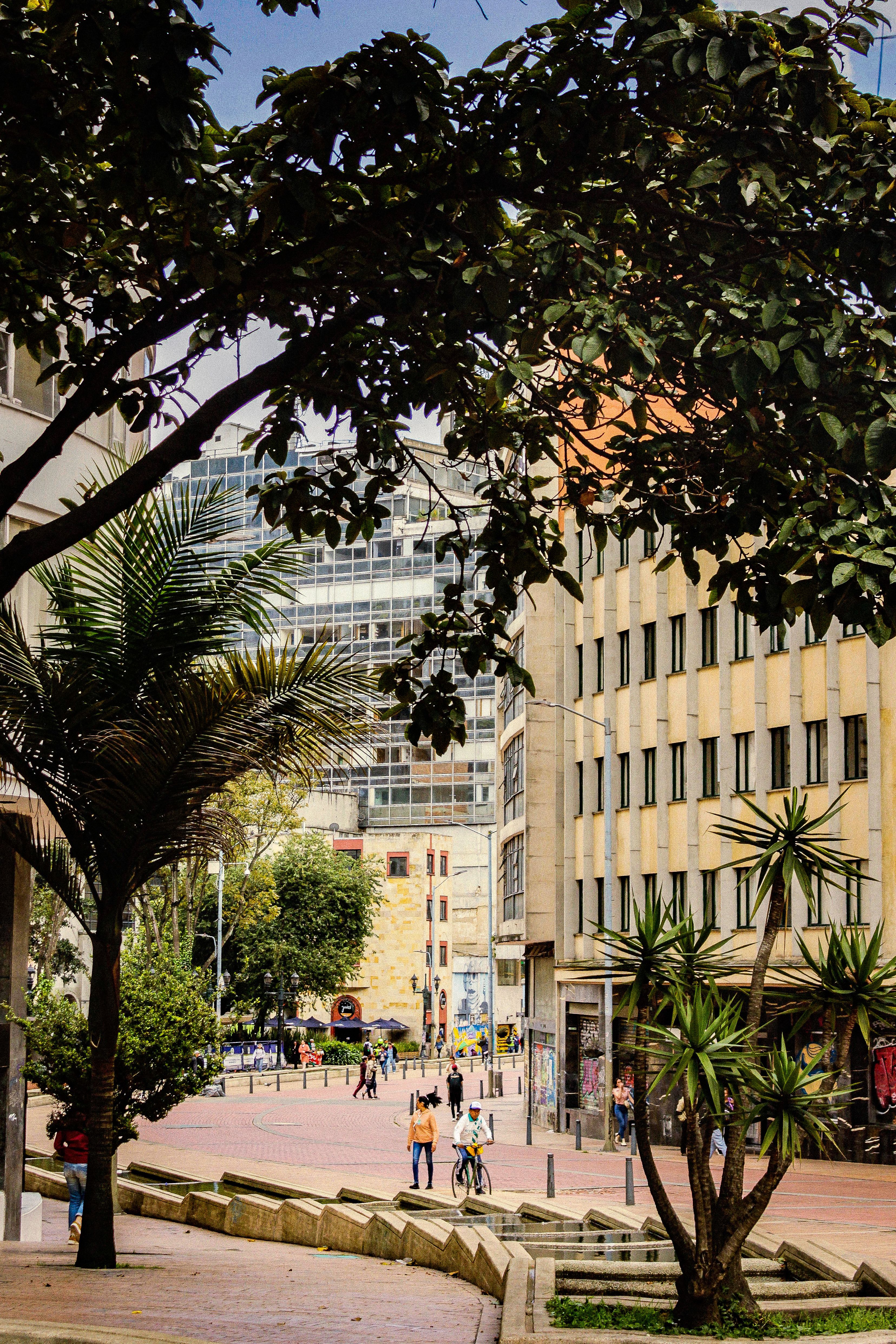 Bustling Urban Street with Modern Architecture · Free Stock Photo