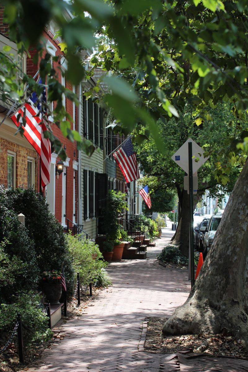Quiet Maryland sidewalk lined with older homes, the kind of street relocation buyers tour in Catonsville