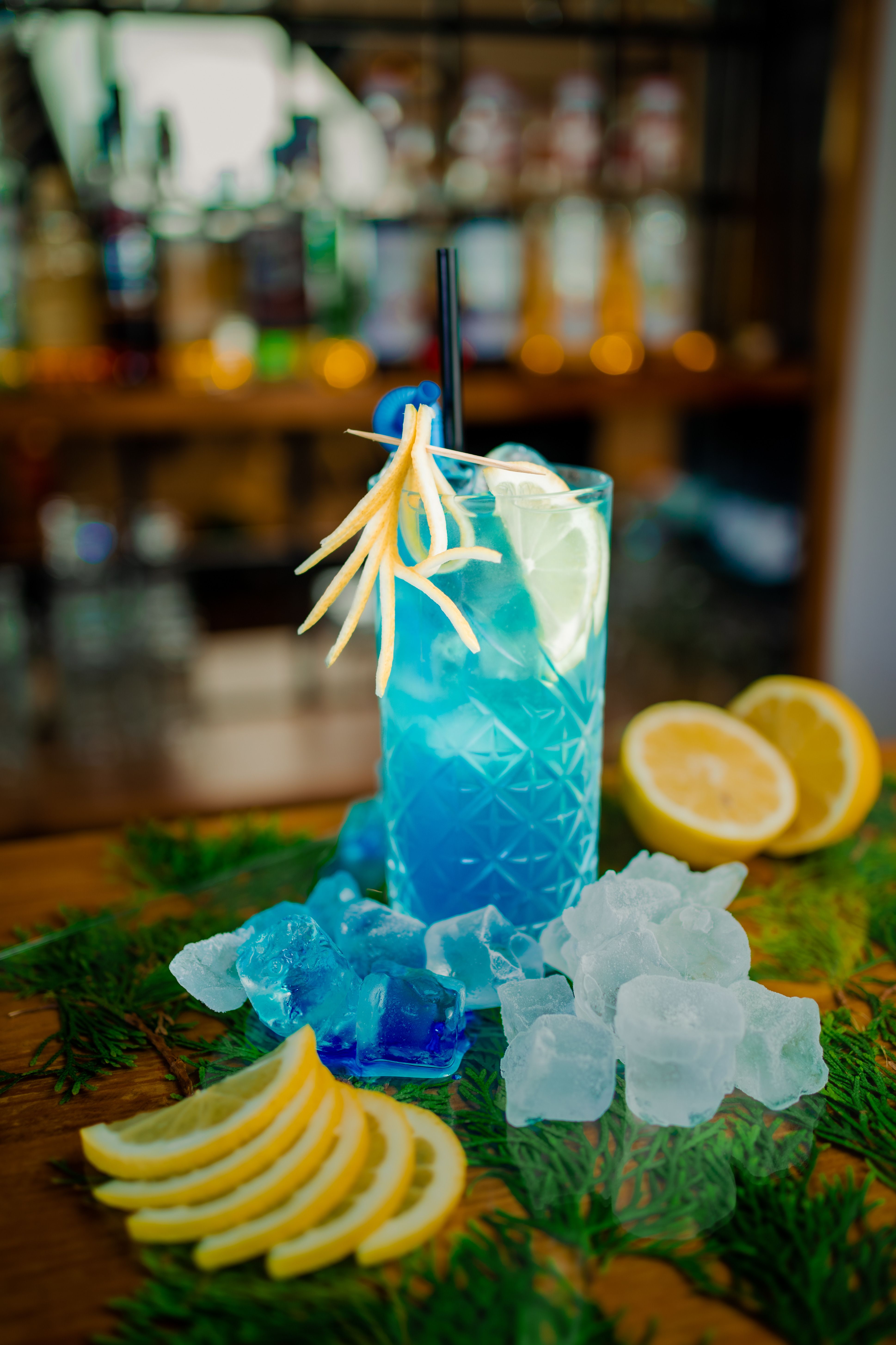 Vibrant Blue Cocktail with Lemon Garnish in İstanbul Bar · Free Stock Photo