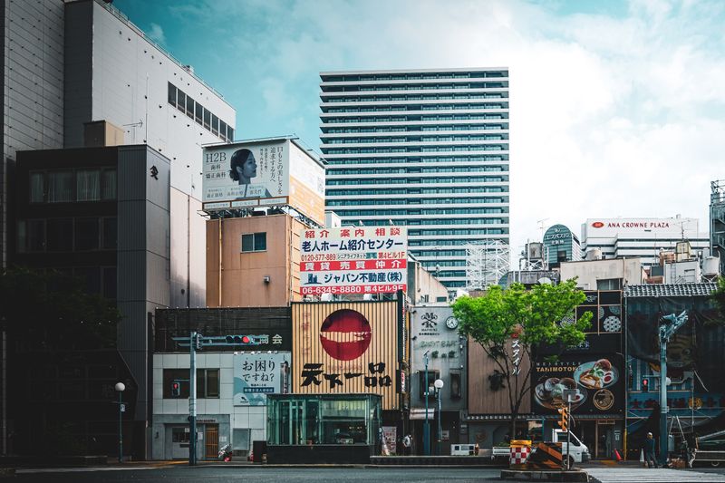 City street with large-format advertising on modern buildings — photo by Kuan-yu Huang on Pexels