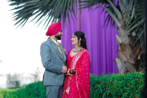 Free Happy Indian couple in traditional attire smiling and holding hands outdoors, capturing love and joy. Stock Photo