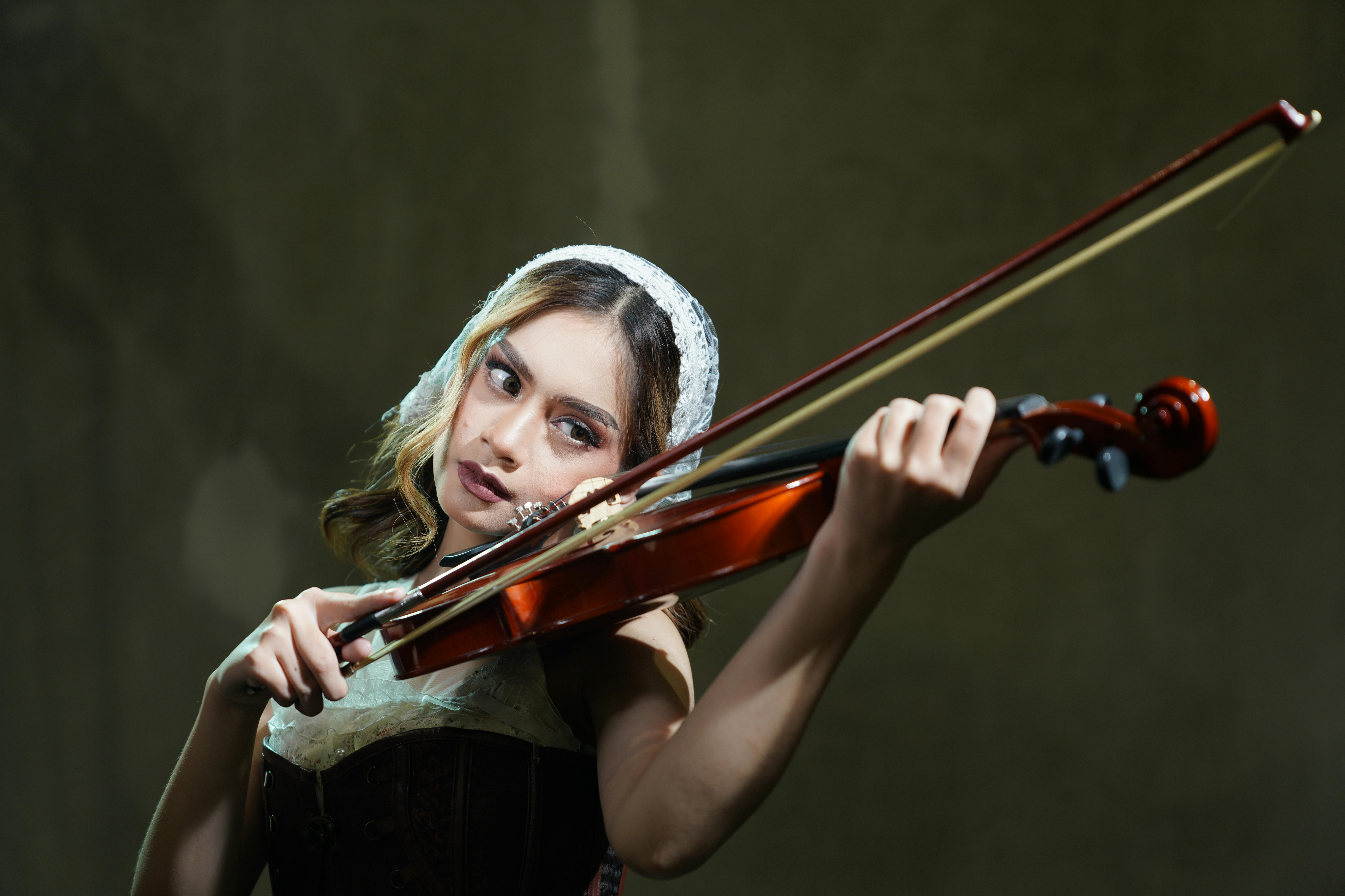 A Woman Playing the Violin · Free Stock Photo