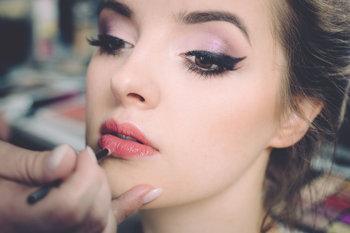 Winged cat-eye eyeliner makeup being applied