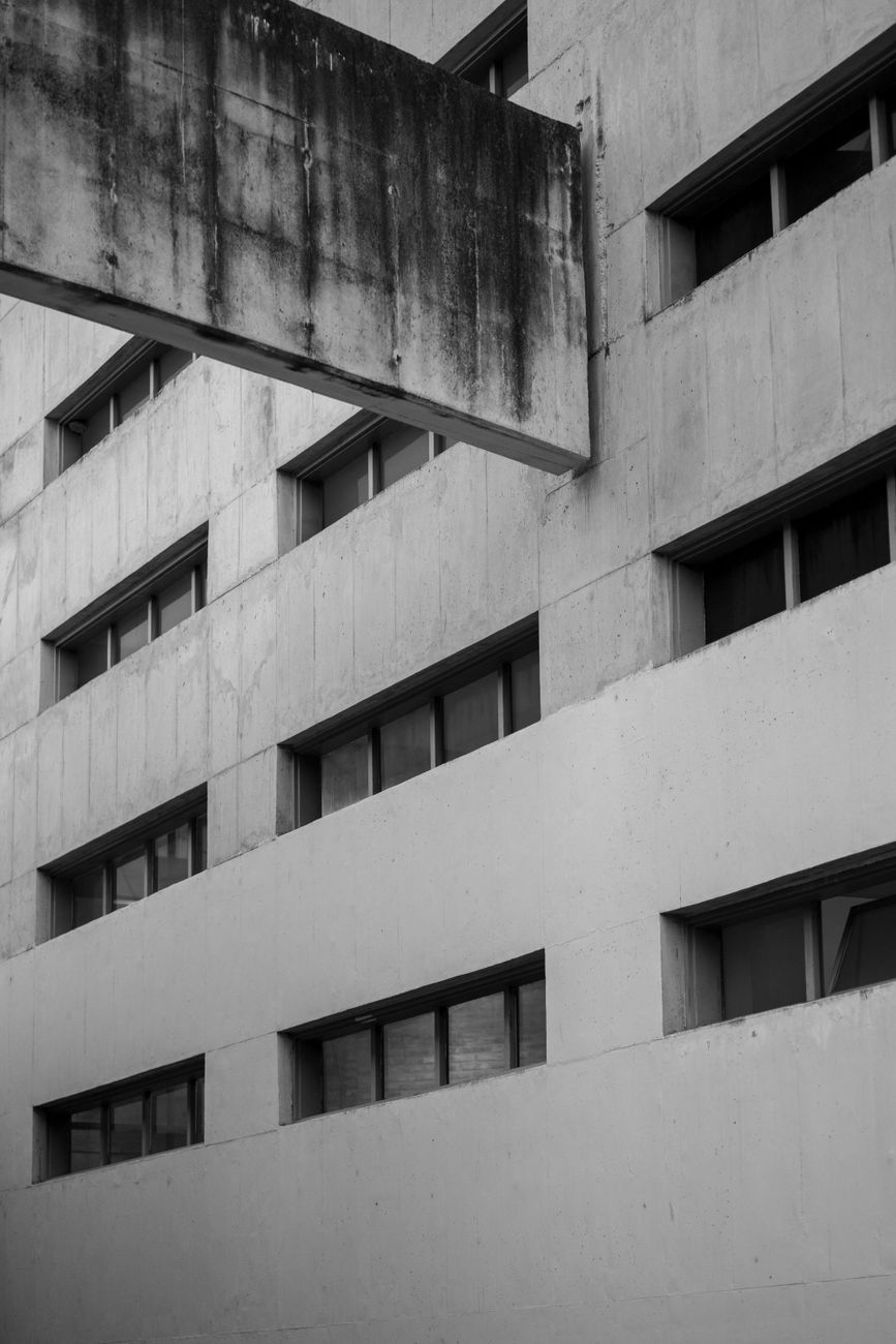 Black and white photo of brutalist architecture in Córdoba, highlighting concrete structures and linear design.. pexels, blac