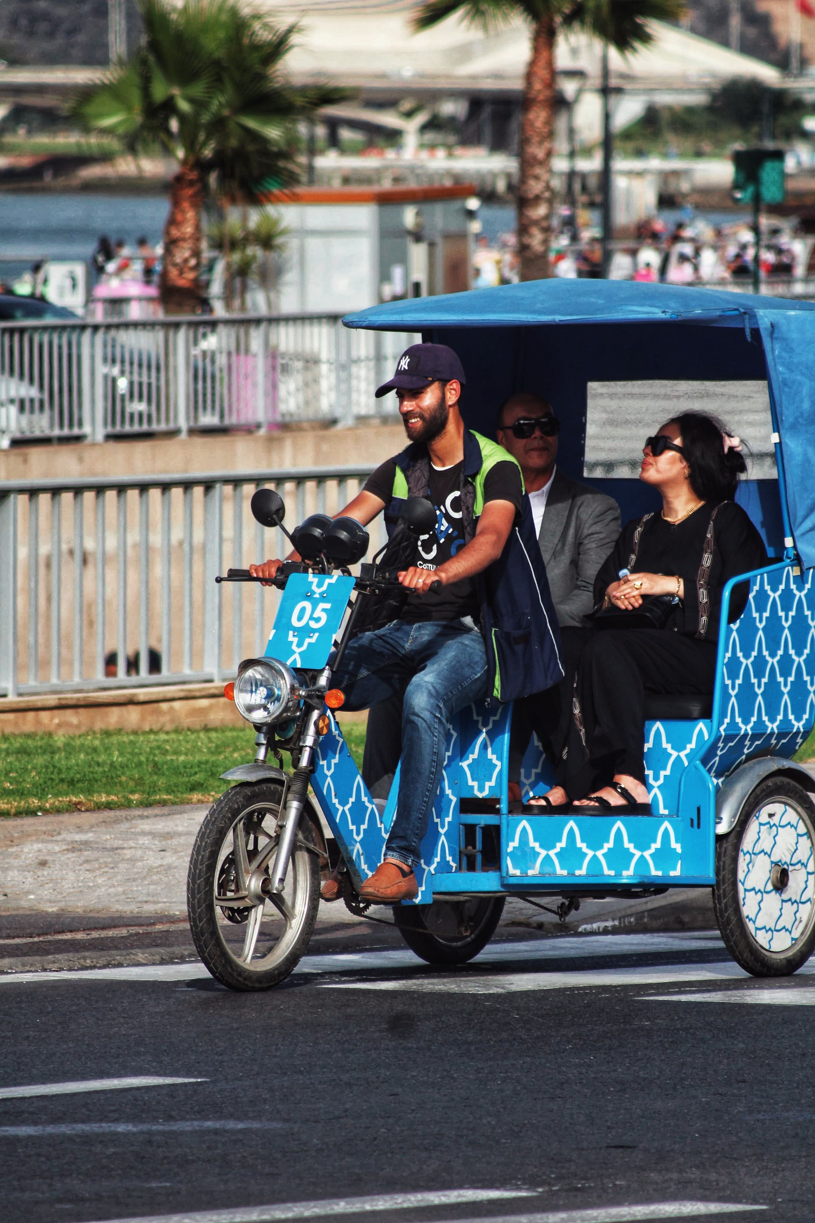 Urban Rickshaw Ride by the Waterfront · Free Stock Photo
