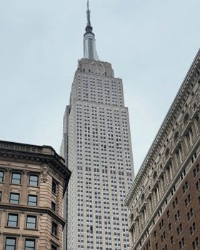 Iconic Empire State Building amidst New York architectural skyline.