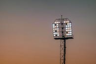Stadium Floodlights Against Twilight Sky