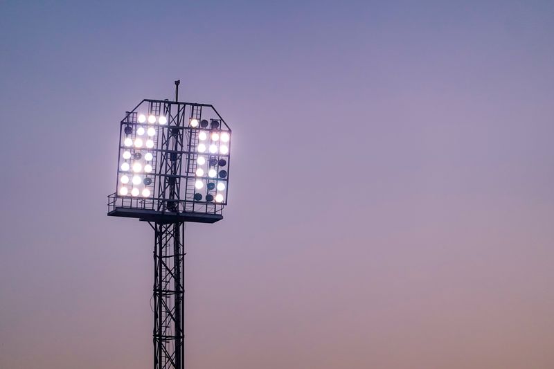 Stadium floodlight tower against a twilight sky — photo by Magda Ehlers on Pexels