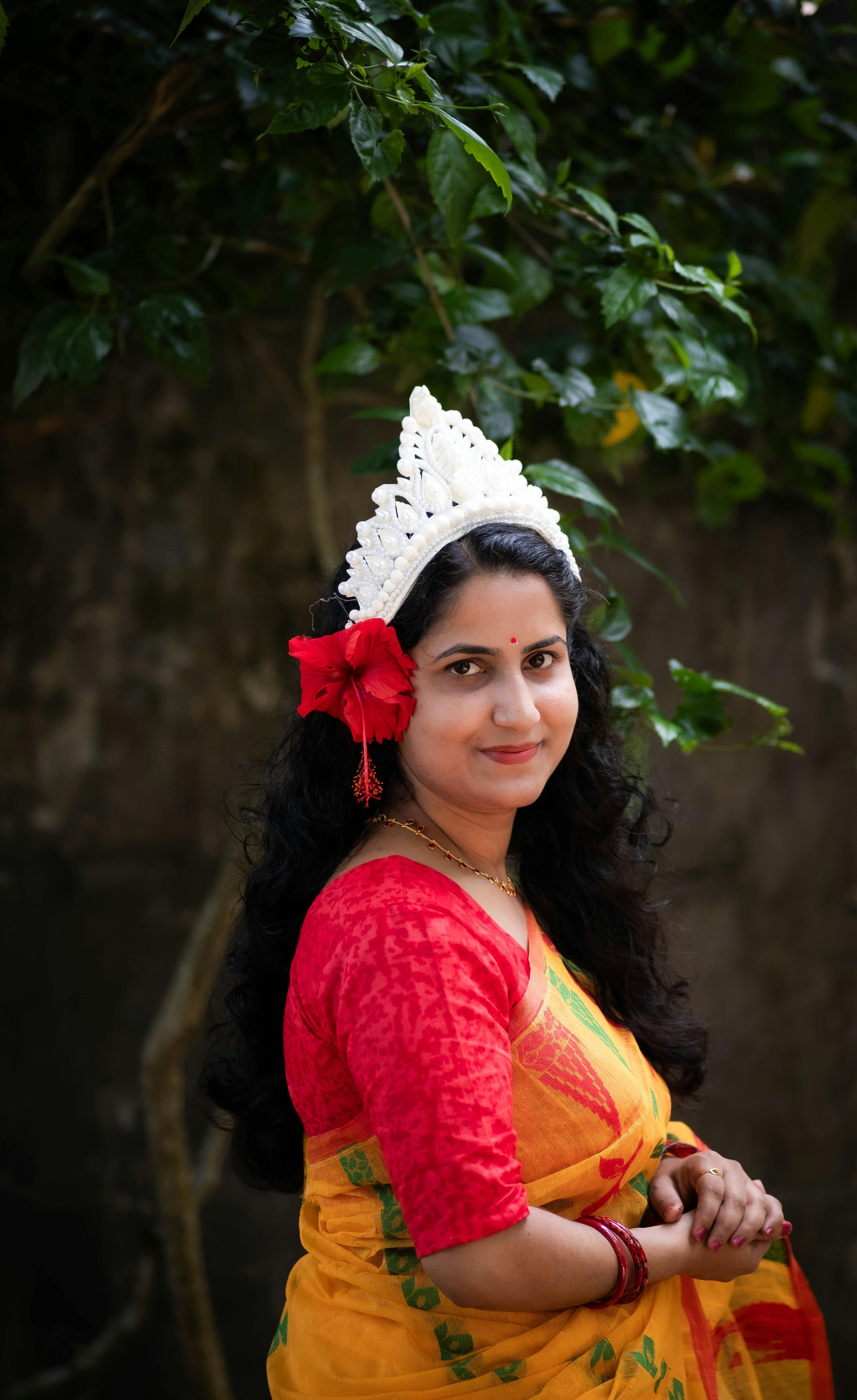 Portrait of a South Asian woman in traditional Bengali dress with festive accessories in Sylhet, Bangladesh.