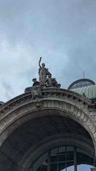 Intricate stone archway with statues at Nuremberg station, Germany.