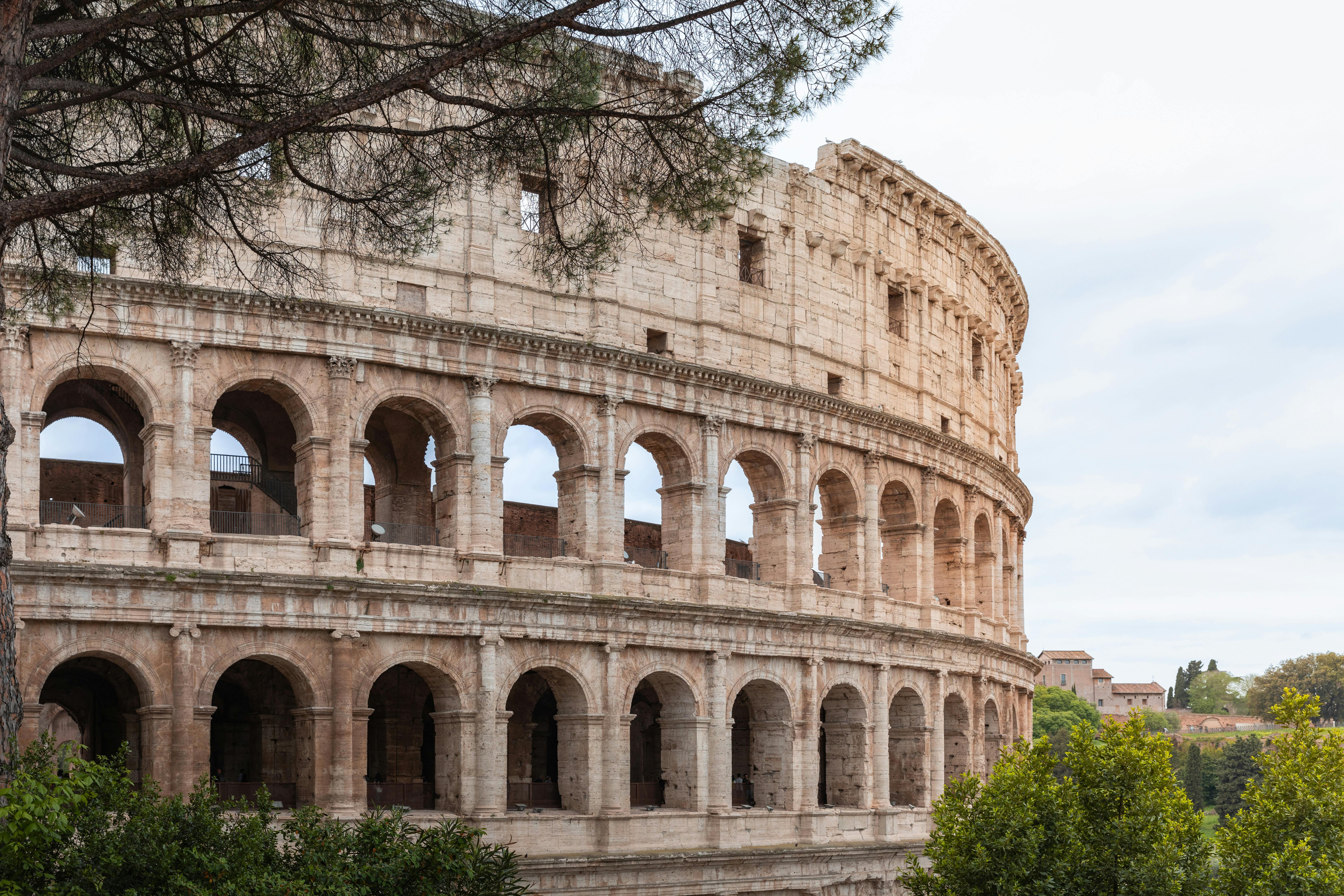 Free Discover the majestic Colosseum in Rome, a symbol of ancient Roman engineering and iconic architecture. Stock Photo