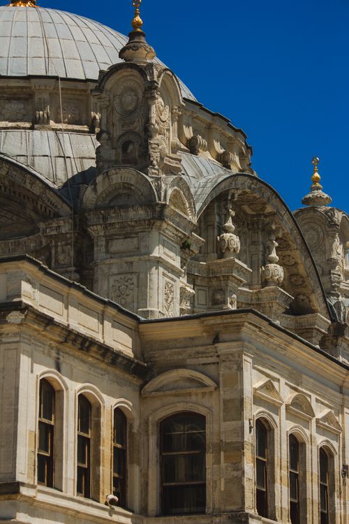Free Close-up of an ornate historical dome with intricate designs under a clear blue sky, showcasing architectural beauty. Stock Photo