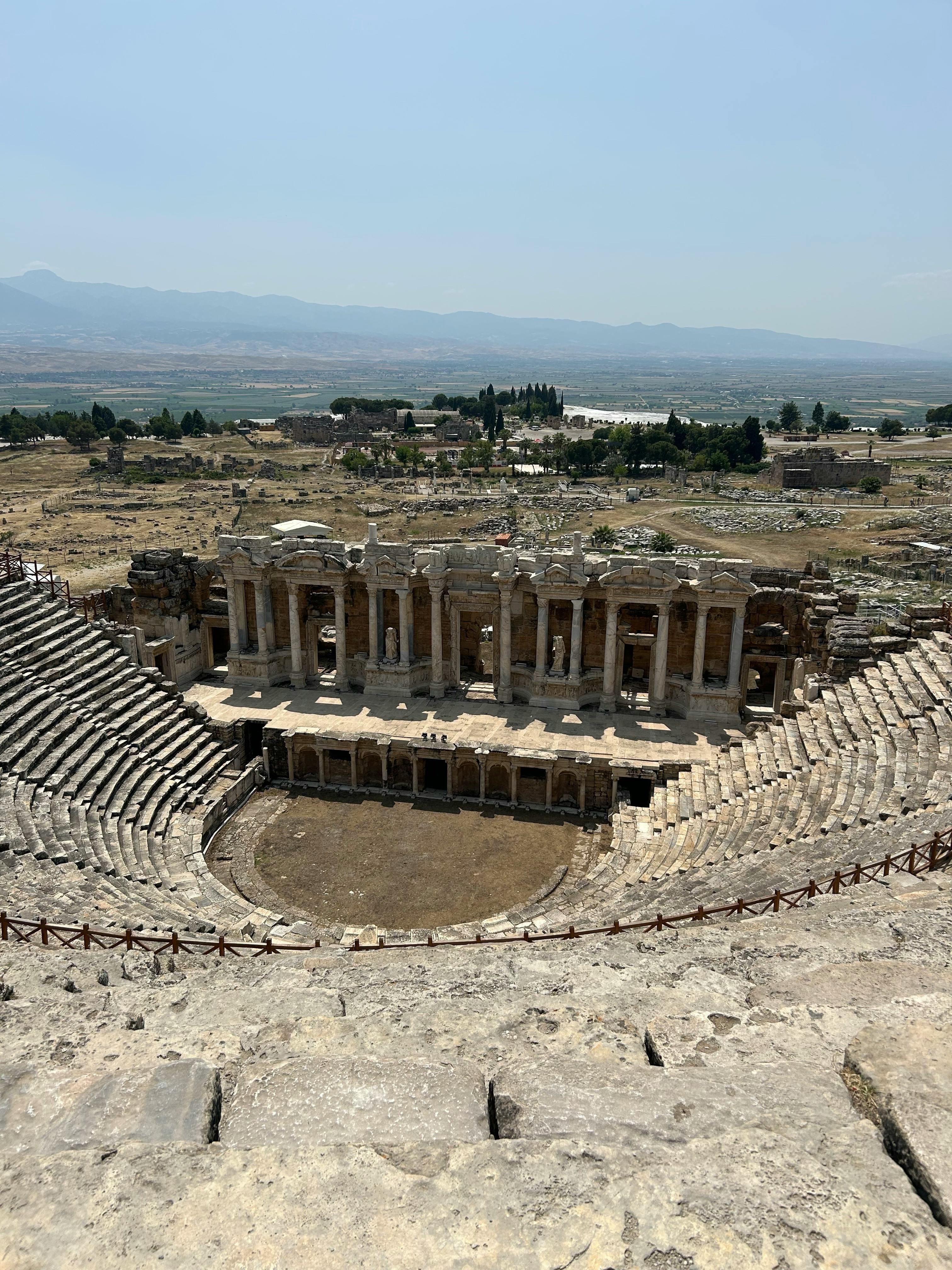 Free A breathtaking view of the ancient Roman theatre at Pamukkale, a UNESCO World Heritage site in Türkiye. Stock Photo