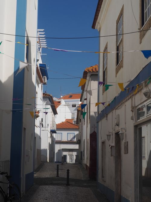 Free A picturesque street with traditional houses in Ericeira, Lisbon, Portugal. Stock Photo