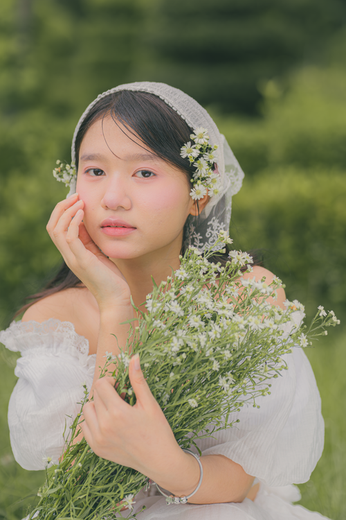 Young Woman with Floral Bouquet Outdoors · Free Stock Photo