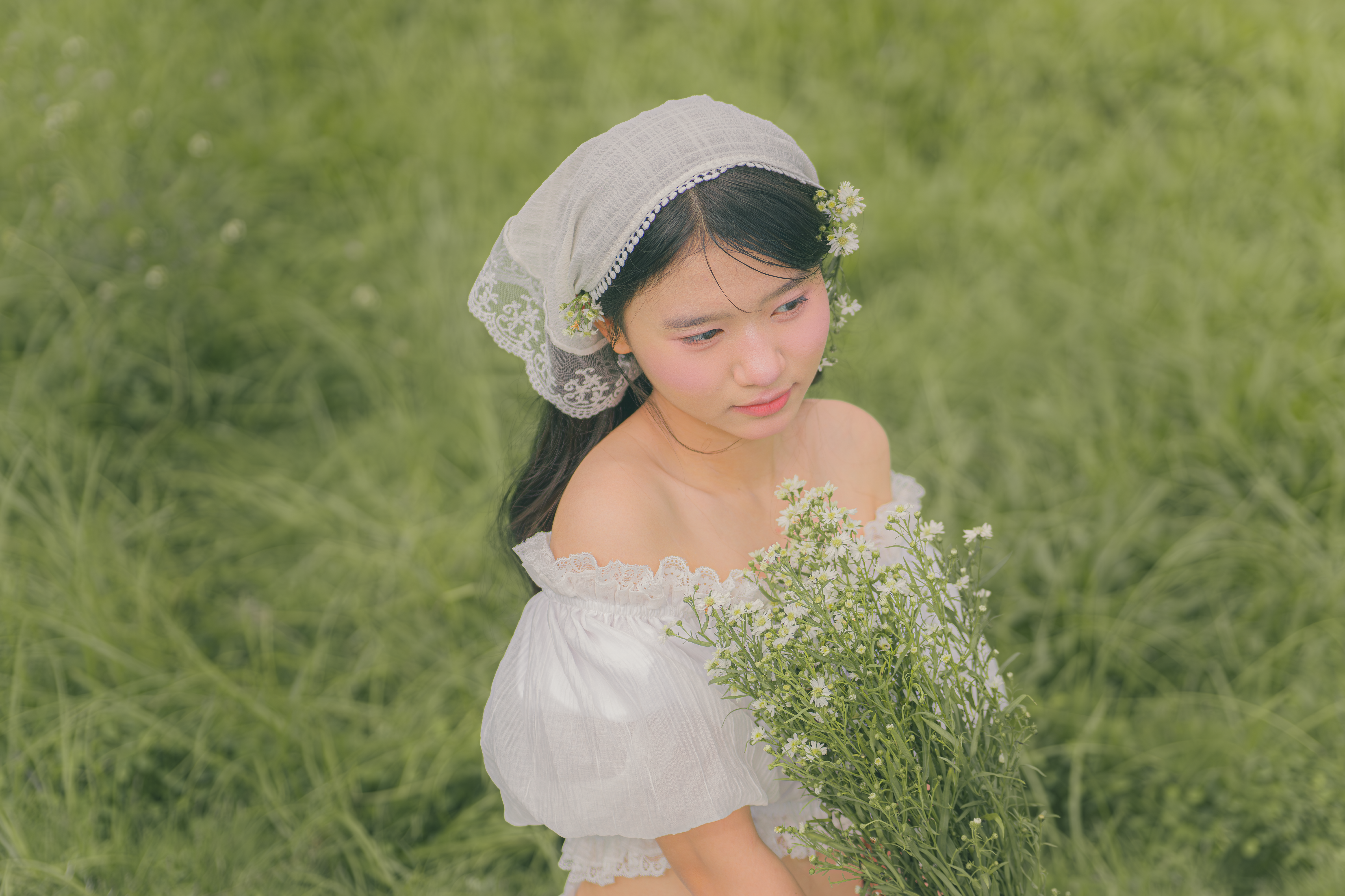 Young woman in white dress with wildflowers · Free Stock Photo