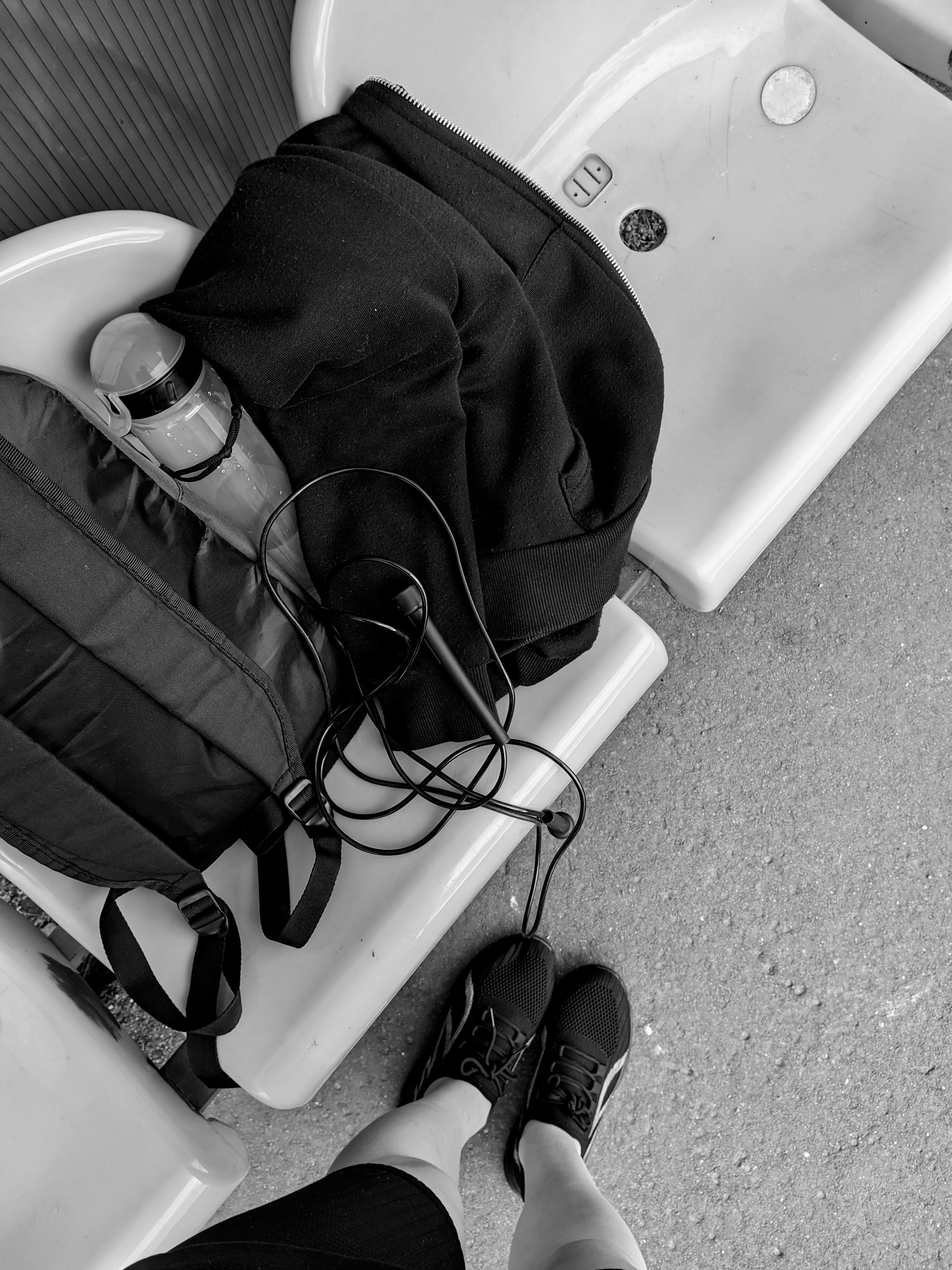 Black and white image of travel items on a bench in Borisov, Belarus.