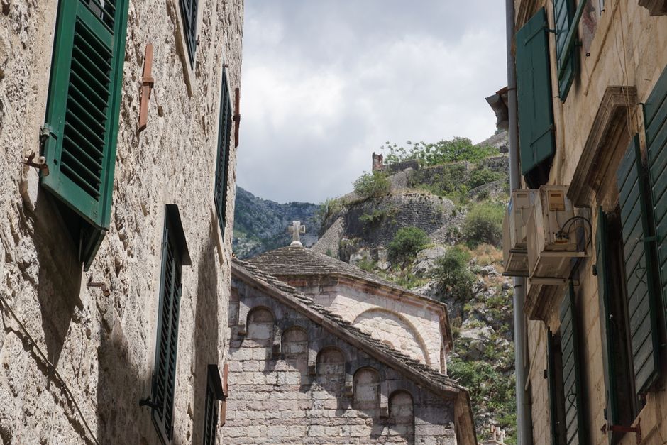 Tourists walking in a crowded street in Kotor Old Town, Montenegro