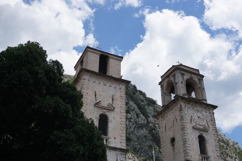 Free Beautiful view of historic towers in Kotor, Montenegro against a stunning sky. Stock Photo