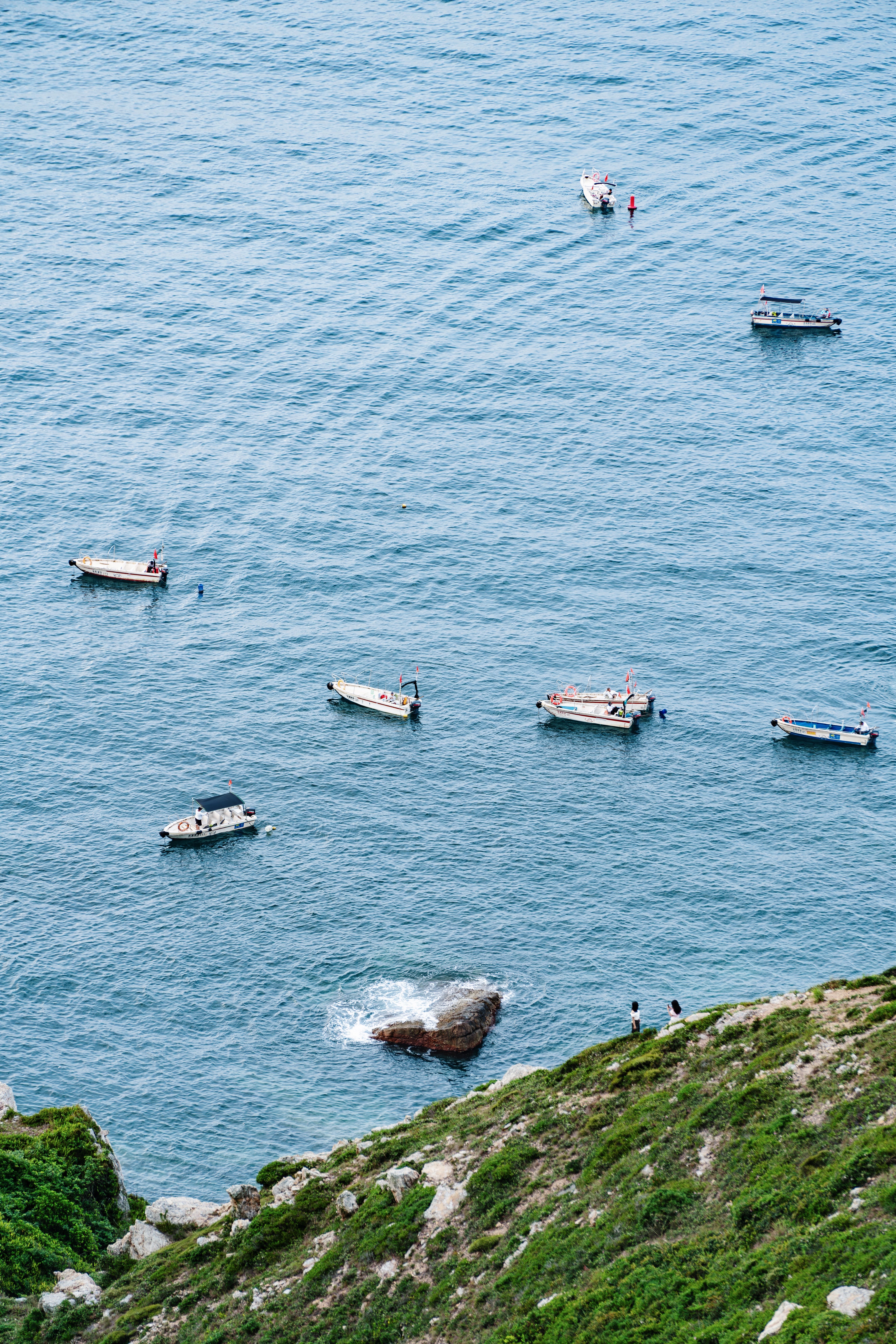 Serene Ocean View with Boats Afloat in Calm Waters