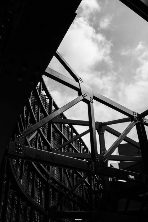 Free Black and white photo capturing the geometric structural beauty of modern architecture in Bergamo, Italy. Stock Photo