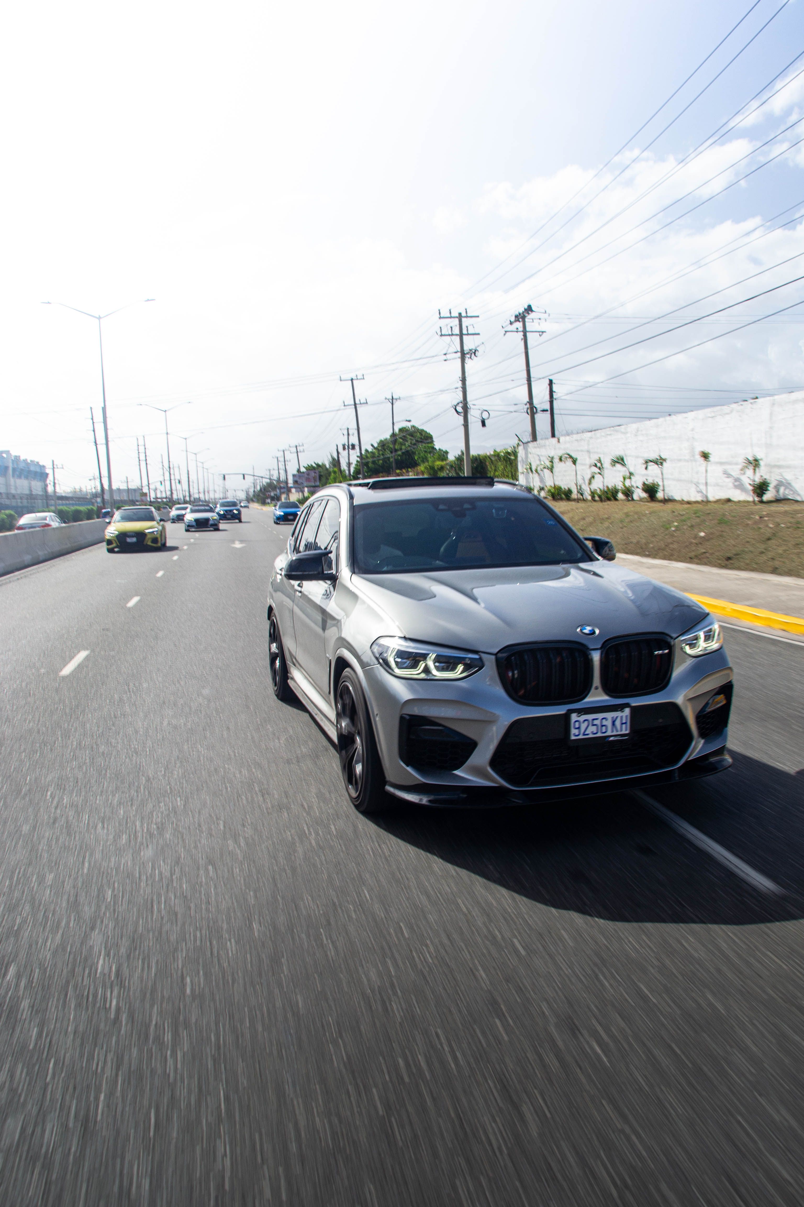luxury-suv-driving-on-a-jamaican-highway-free-stock-photo