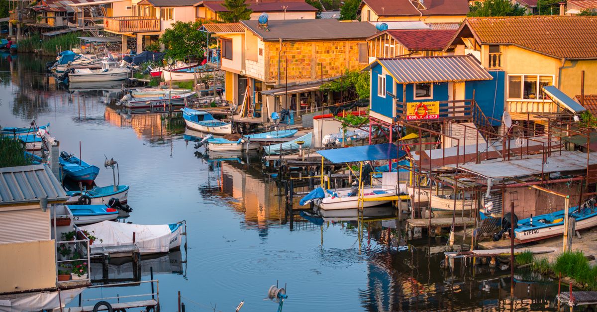 Tranquil morning view of a traditional coastal village with boats in Burgas, Bulgaria.