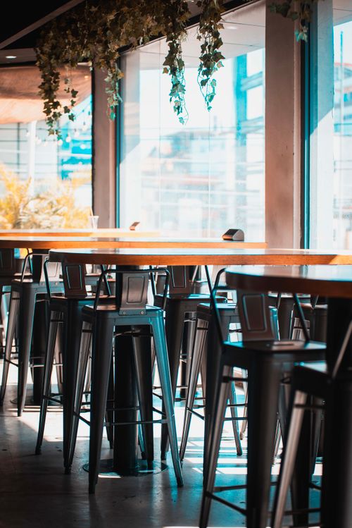 Free A vibrant and modern cafe setting featuring high stools and large windows in Accra, Ghana. Stock Photo