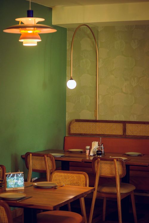 Free Warm, stylish restaurant interior with wooden furniture and soft lighting in Accra. Stock Photo