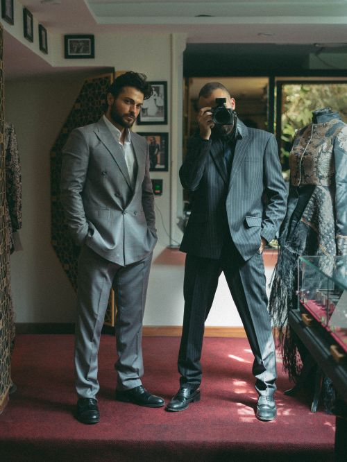 Free Two fashionable men in suits posing in a stylish boutique interior, exuding modern elegance. Stock Photo