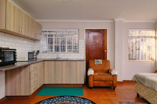 A modern indoor kitchen and living area with natural lighting in Pretoria, South Africa.