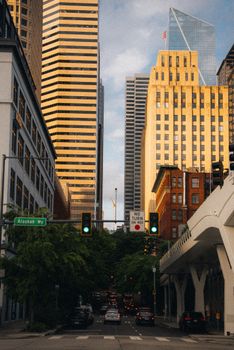 Traffic and urban architecture in downtown Seattle, showcasing skyscrapers and cityscape.