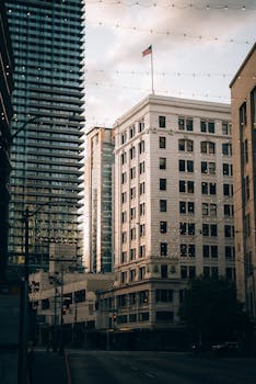 An elegant view of downtown Seattle buildings under evening lights, capturing urban charm at dusk.