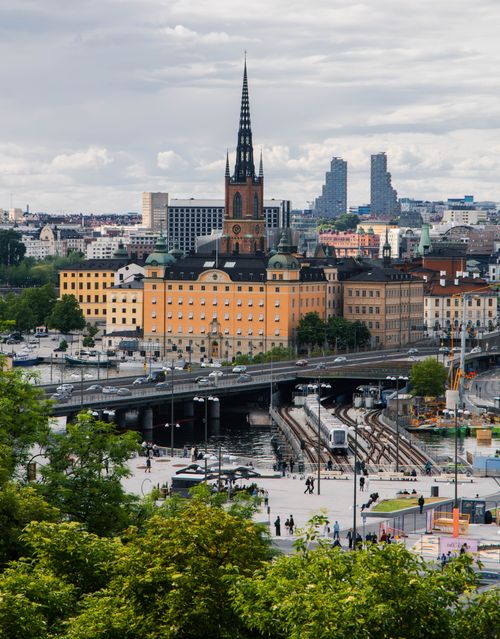 Free A panoramic view of Stockholm's architecture with iconic skyline and railway tracks. Stock Photo